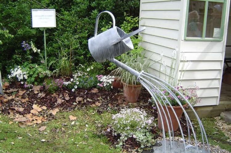 Floating Watering Cans Front Yard Idea